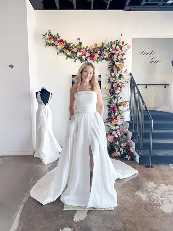 Bride trying on the Aiko Haley Mai wedding dress in the Fort Worth bridal salon